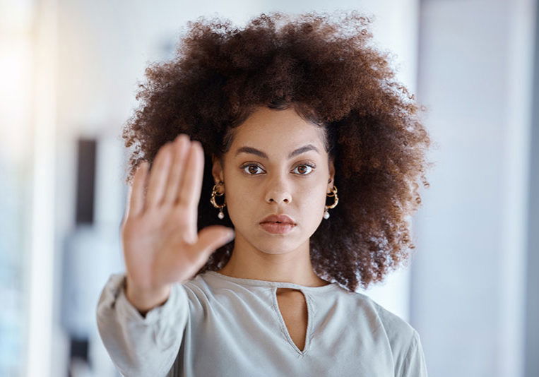 Hands, hr and manager stop sign with hand in office, serious, power and change in corporate. Black woman fighting sexual harassment, discrimination and toxic work environment with employee protection.